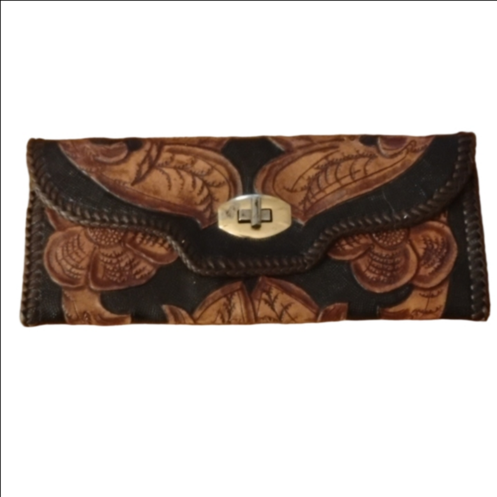 Pretty hand tooled leather wallet. Brass?  May be a little tarnished as shown.